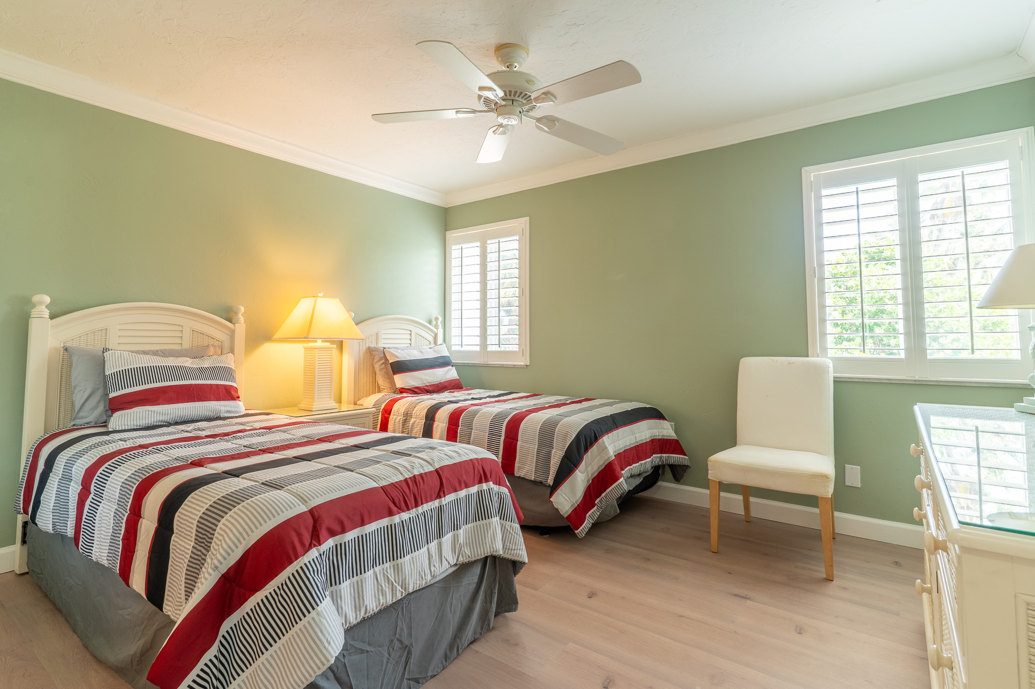 Guest bedroom with twin beds. Plenty of storage.