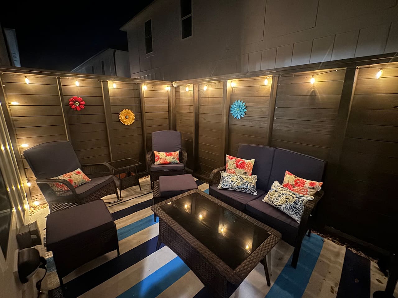Grill with tools and bar cartColorful lounge seatingOutdoor shower Teak dining set for 8-10 available in front of unit (community amenity)Enclosed for pets w/ baby gates