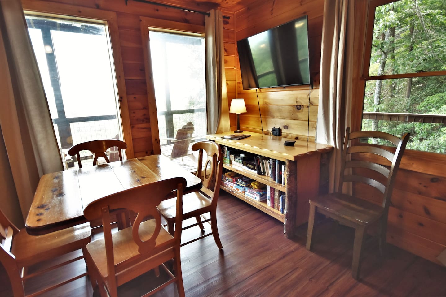 The game room has a game table, 55" smart TV, books and games. 