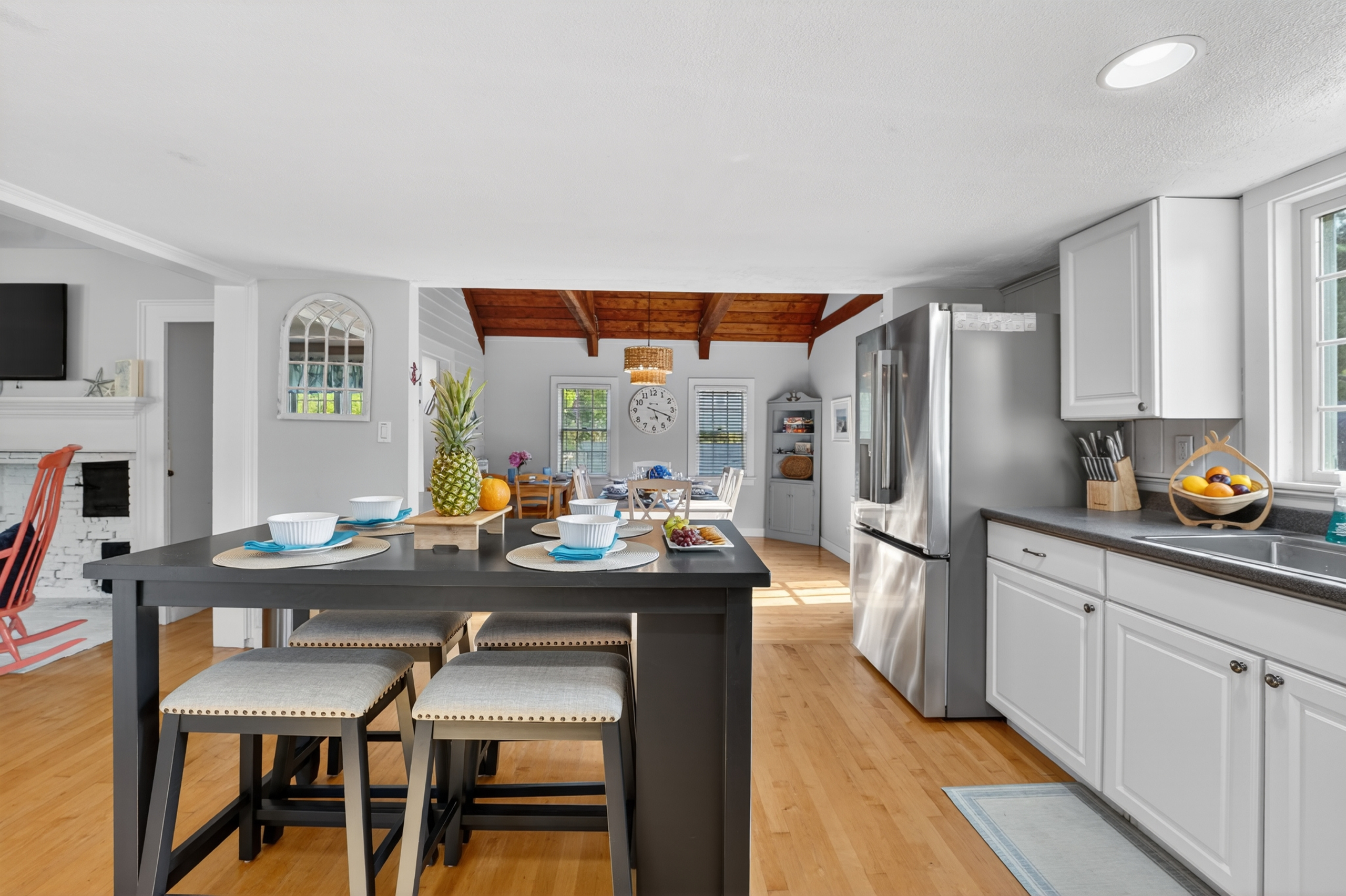Open-concept kitchen and dining area designed for gathering, featuring a spacious island and seamless flow into the living space.