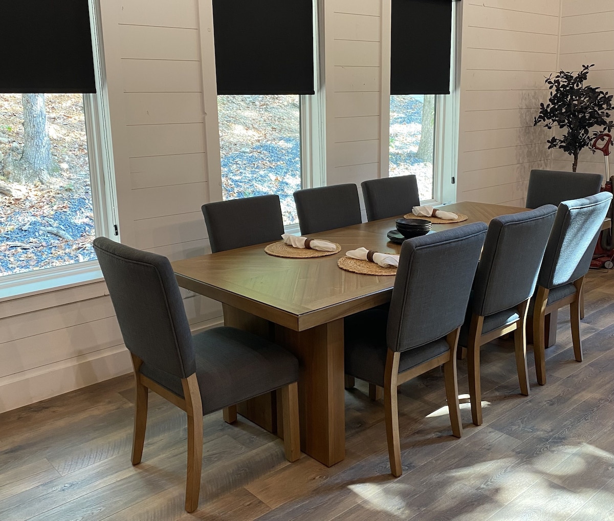 Dining table has eight chairs and an additional table leaf to extend 18"
