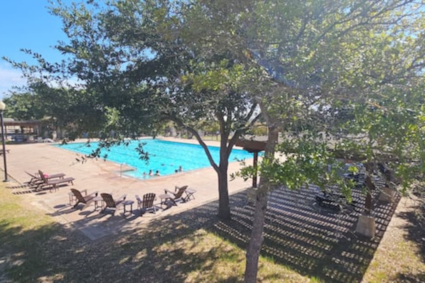 Community pool and lounge chairs just steps away for sunny afternoons.
