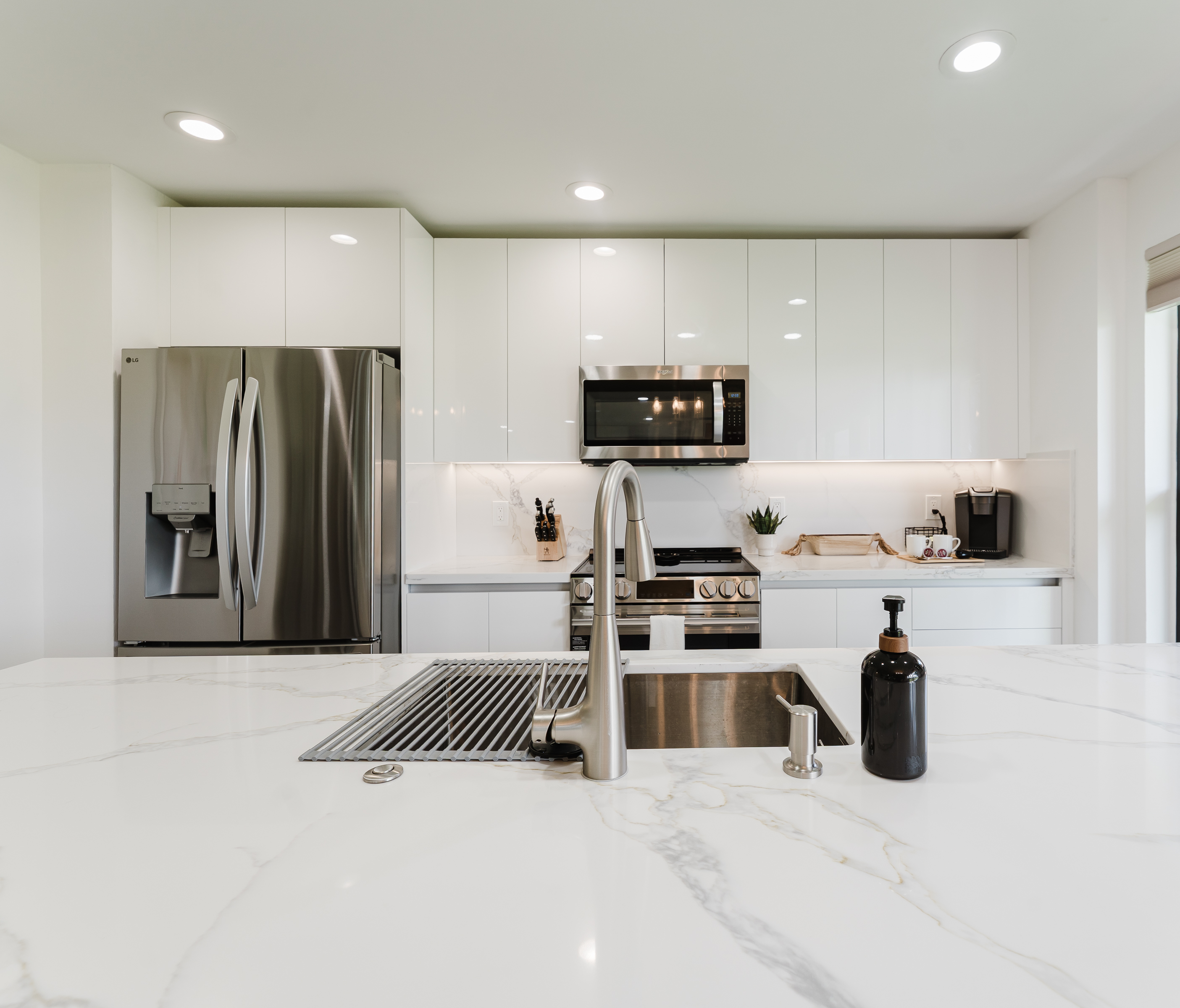 Fully equipped kitchen with everything needed for home-cooked meals. Modern appliances and ample counter space for easy meal prep. Bright and functional kitchen perfect for extended stays.