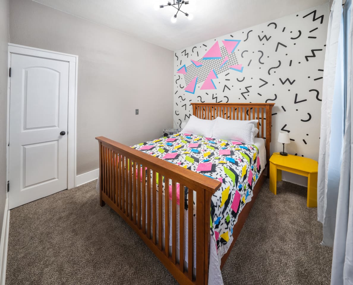 Say hello to the 80's room featuring a queen bed.