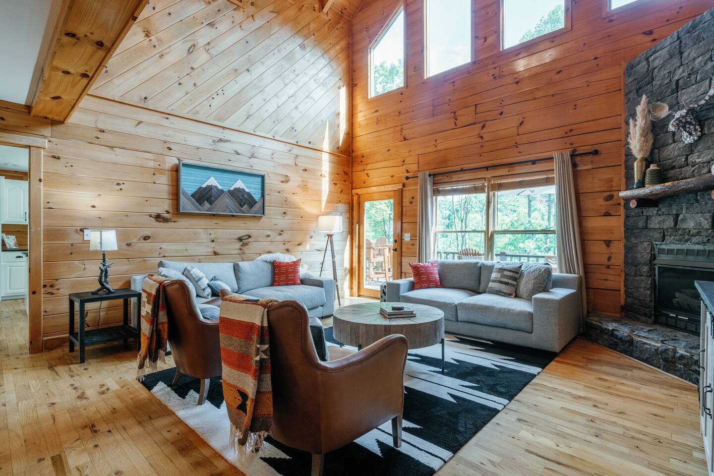 Living room with gas fireplace (operational October 1 -April 1) and seating for 8-10.
