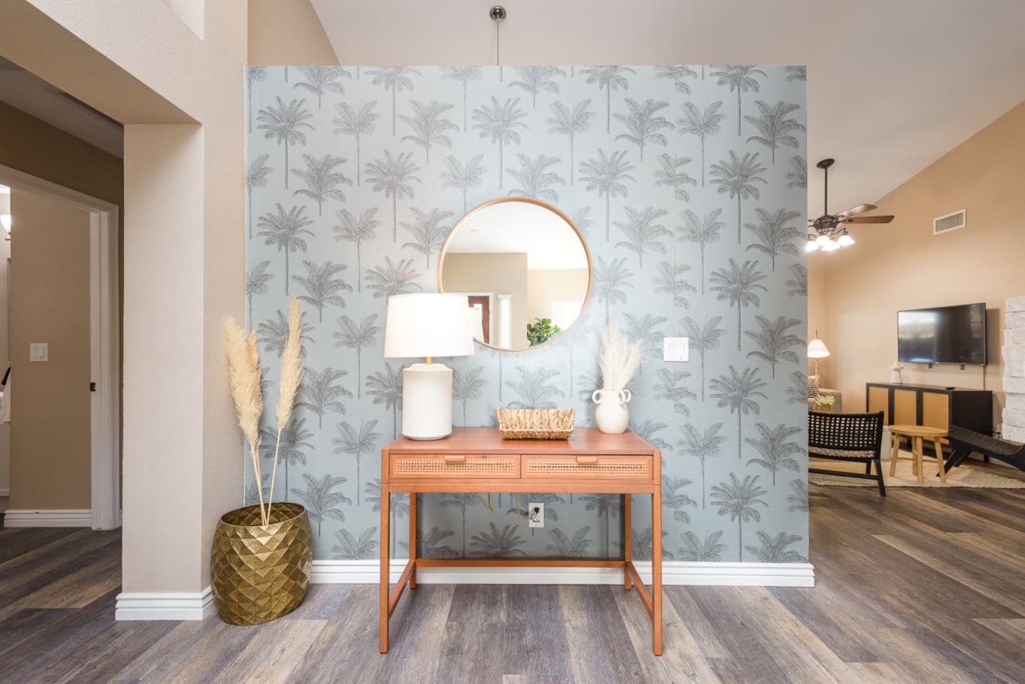 Welcoming interior detail with mirror, lamp, and a clean styled console near the main living spaces.