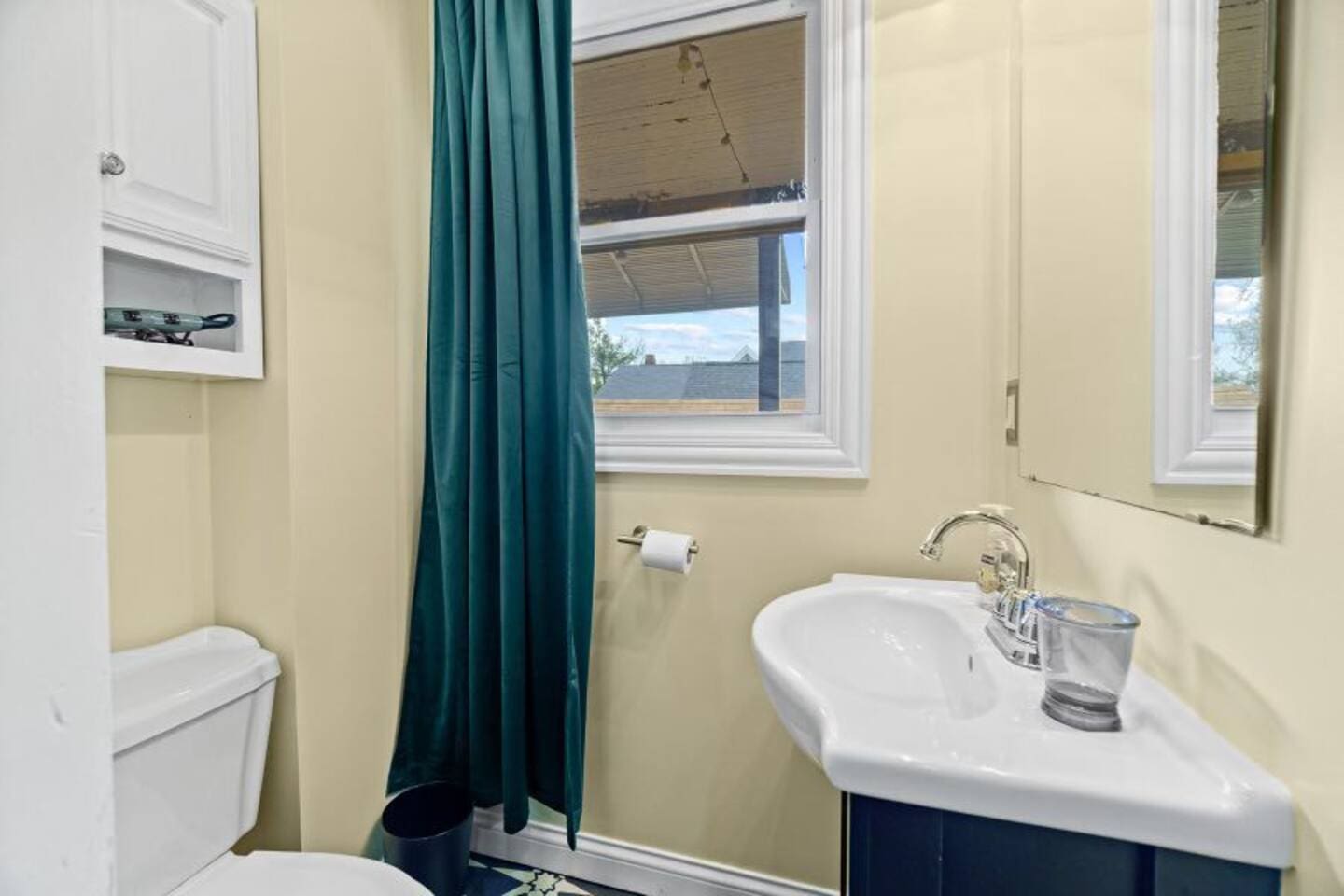 Bathroom featuring a sleek toilet and stylish sink, designed for both functionality and modern appeal.