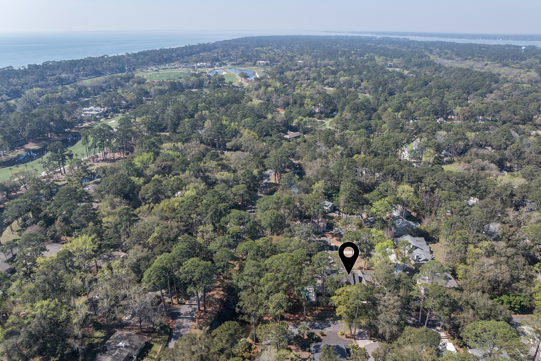 Aerial view of home with Atlantic on the left and Calibogue Sound on the right