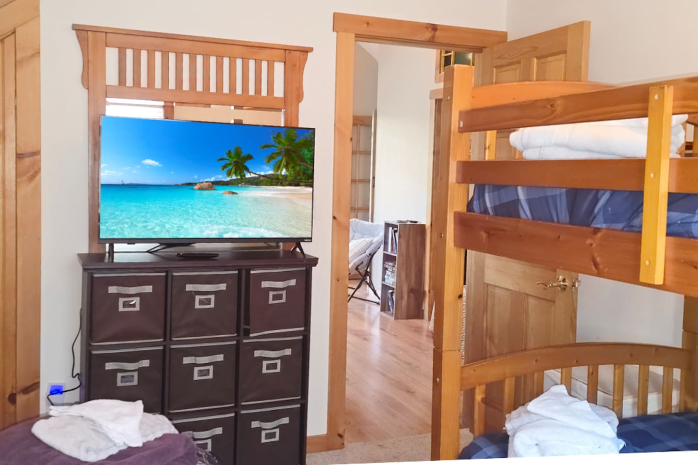 Another angle of bedroom 2 with 3 beds plus TV ready to hold your whole family!