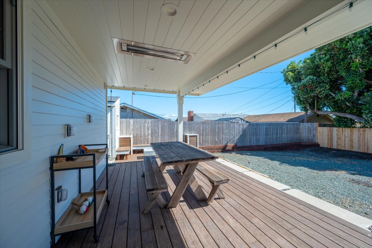 Back porch with heater for outdoor comfortable dining.