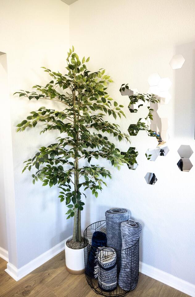 Thoughtful living room touches, like a cozy blanket basket and soft lighting, add warmth and charm to your stay.