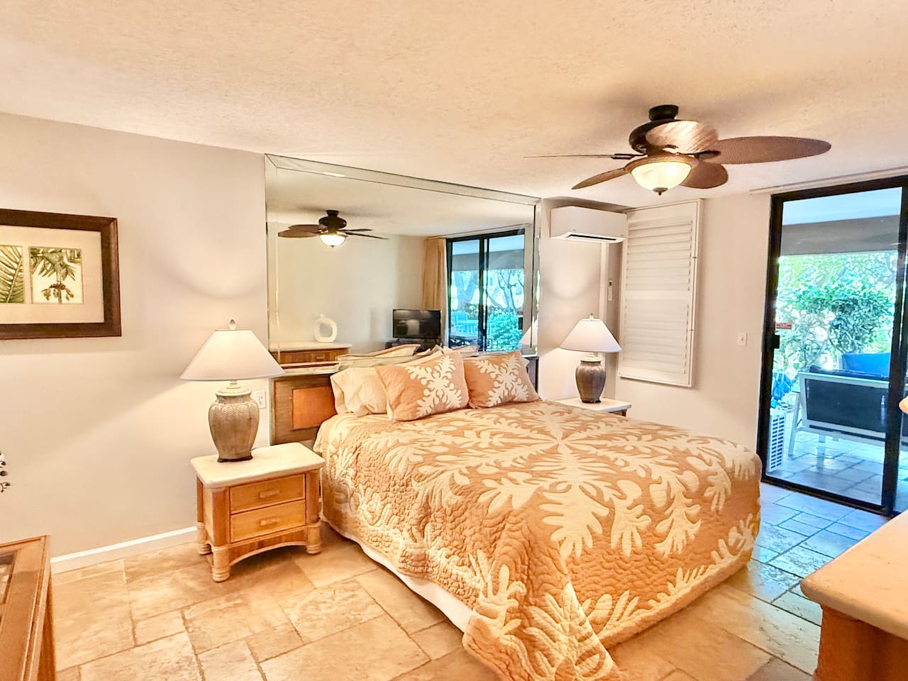 Main Bedroom - King bed, tv, and airy island decor. Wake up to gentle breezes and soft natural light for the perfect start to your day in paradise