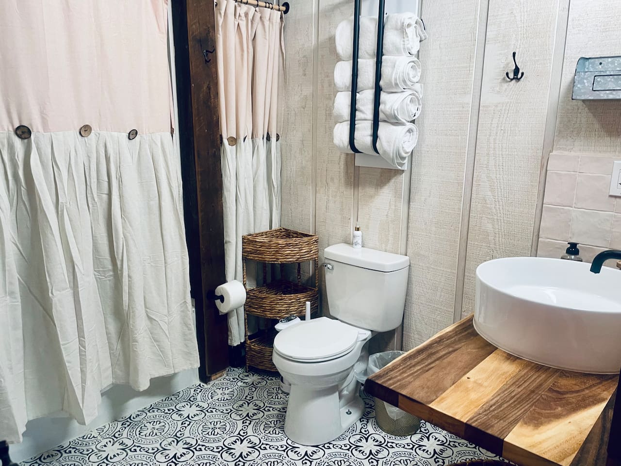 Tub/shower combination, toilet with bidet, beautiful live edge bathroom vanity with oversized vessel sink make this 8’X8’ bathroom the exception to the rule in a tiny home.  There’s nothing small about this bathroom. 