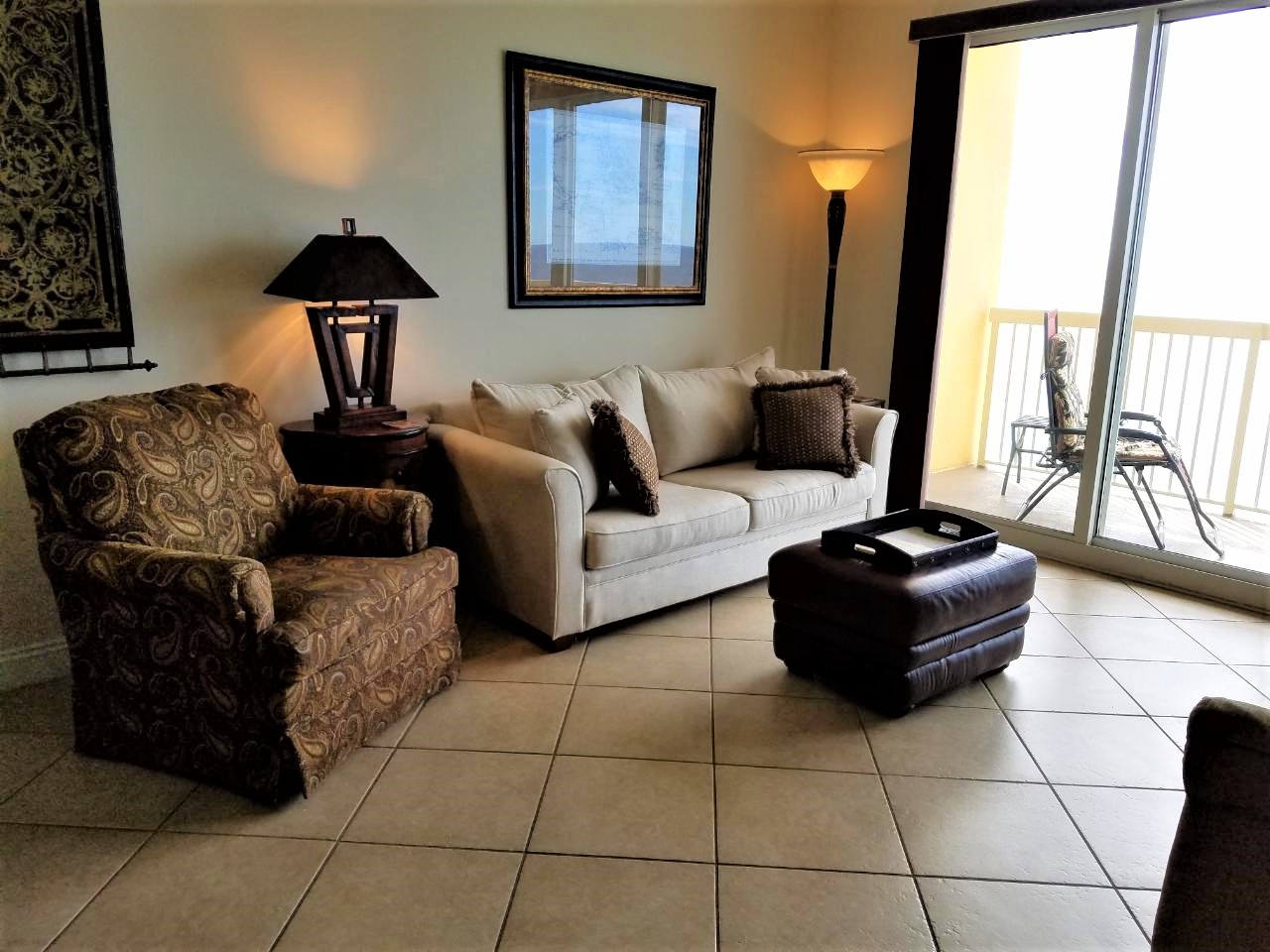 Spacious main living area with tropical decor & gorgeous views of the water