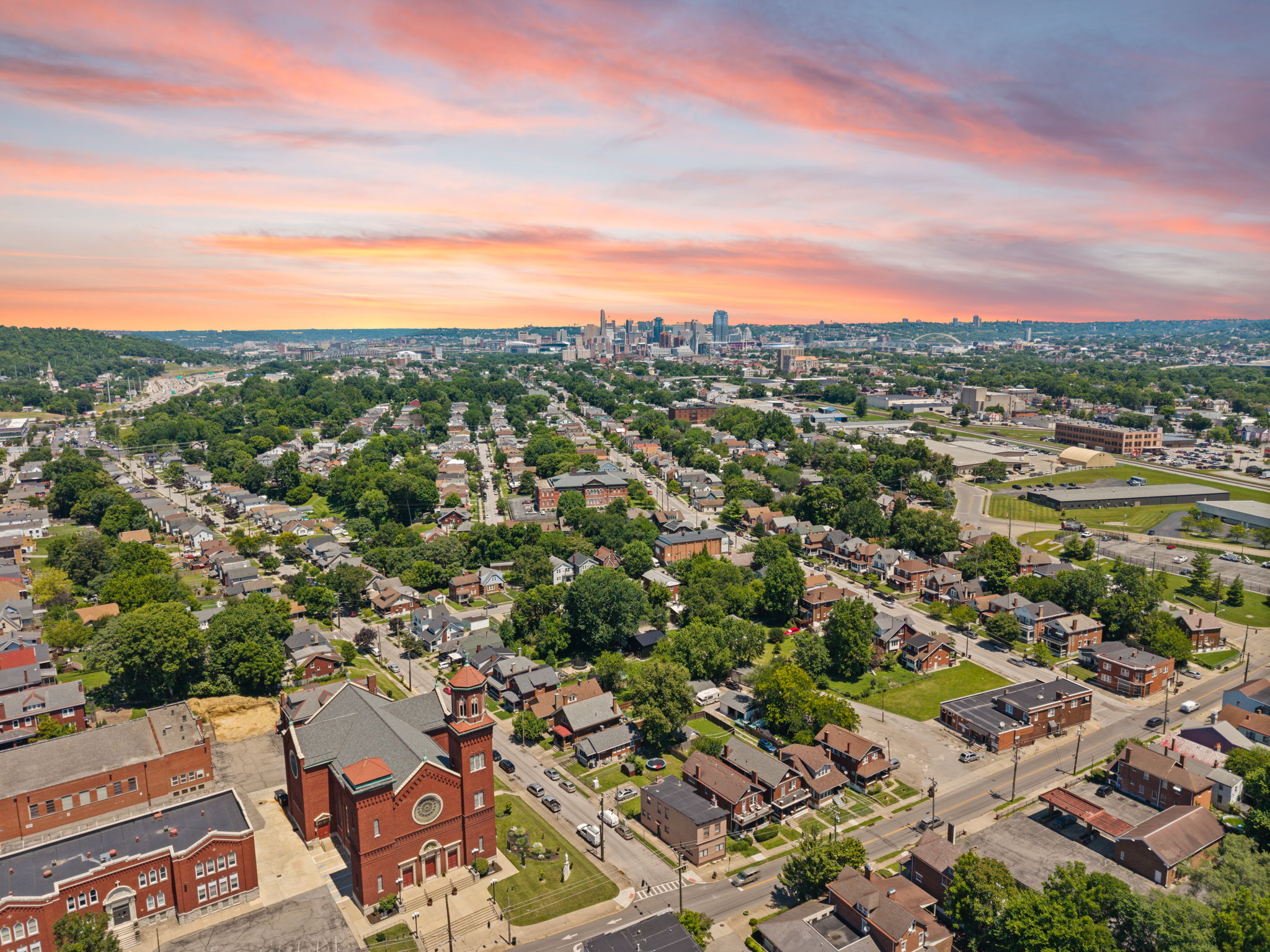 Stunning golden-hour aerial view of the Highland Pike neighborhood at sunset