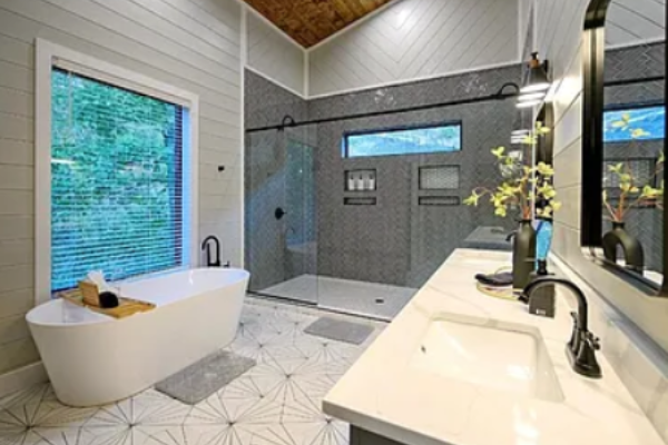 Spa-inspired bathroom with soaking tub and glass-enclosed shower.