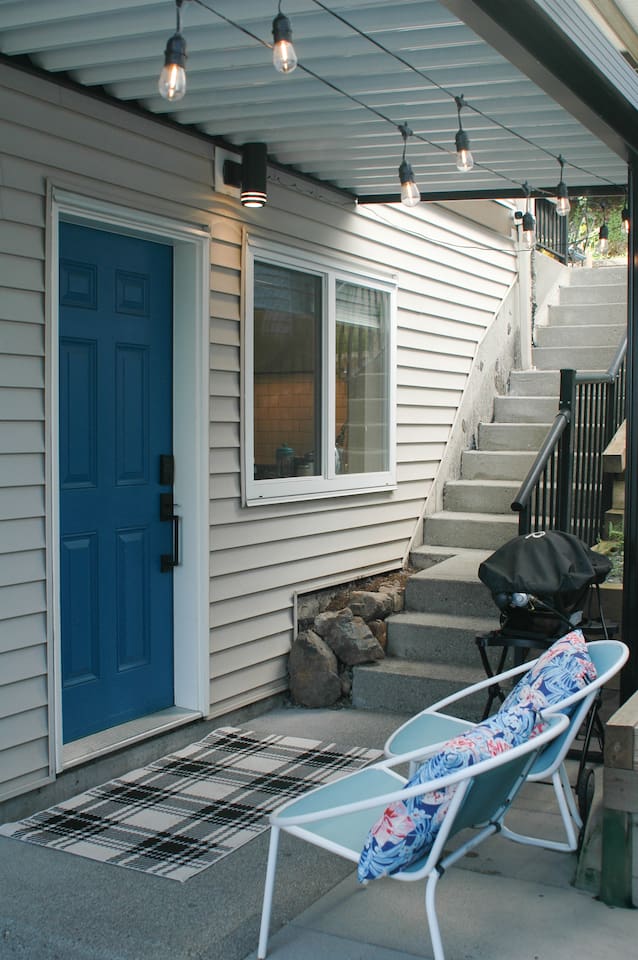 Outdoor seating with a covered roof and Webber bbq. 