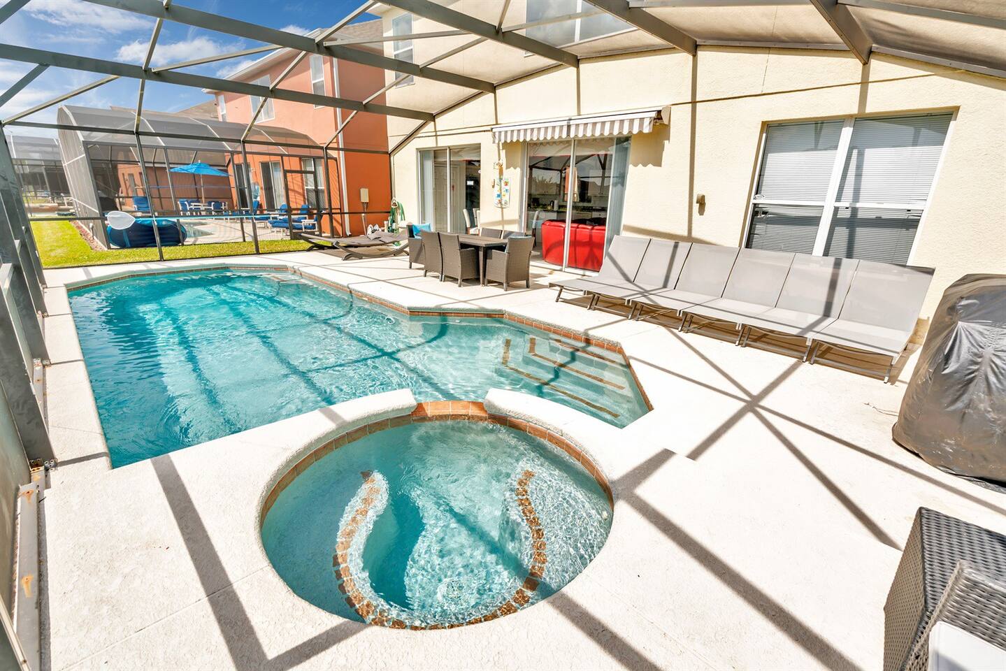 Private backyard south facing pool and hot tub with view of lake.