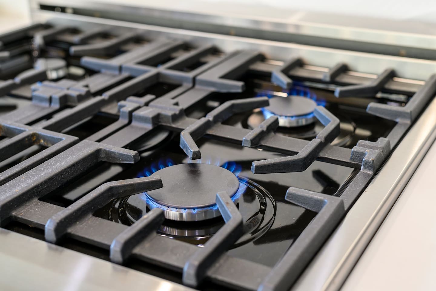 Kitchen is equipped with gas-powered burners for an elevated experience. 