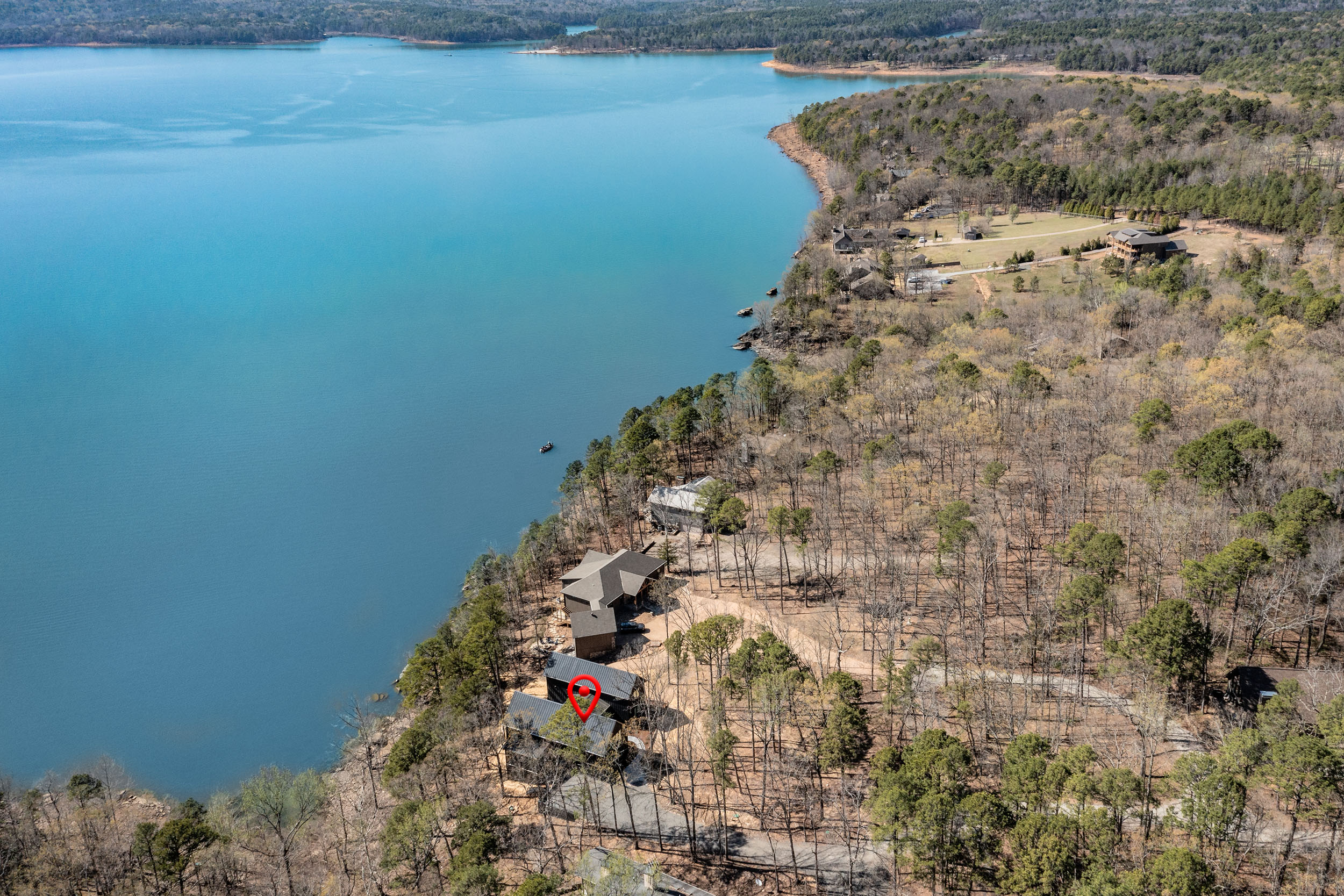 Tucked into the trees and just steps from the lake, Sunset Cove Getaway offers a private escape with unbeatable Greers Ferry views