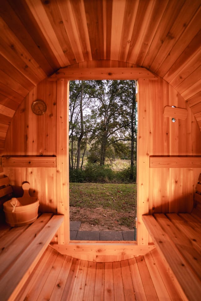 The sauna offers a peaceful retreat with serene views, perfect for unwinding in nature’s embrace.