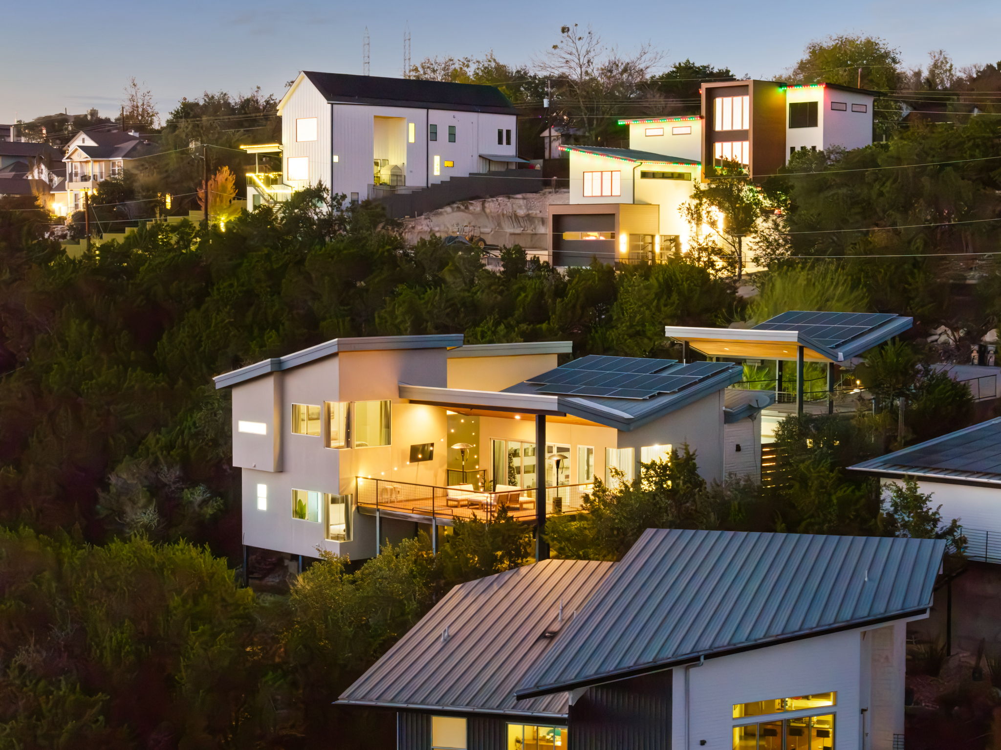 Twilight exterior highlighting the home’s modern architecture