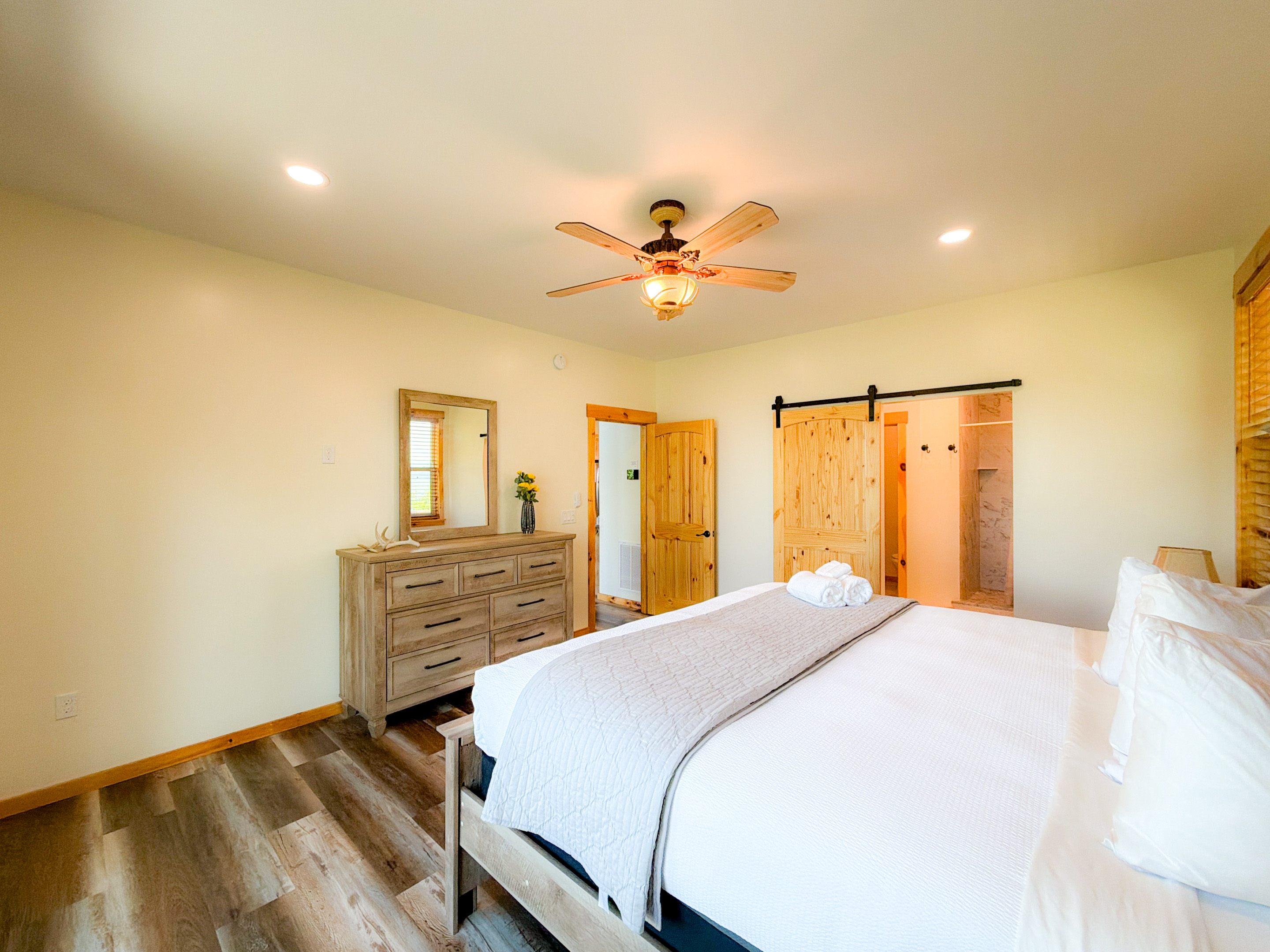 Master Bedroom. Large En-suite bathroom through the beautiful barn doors.