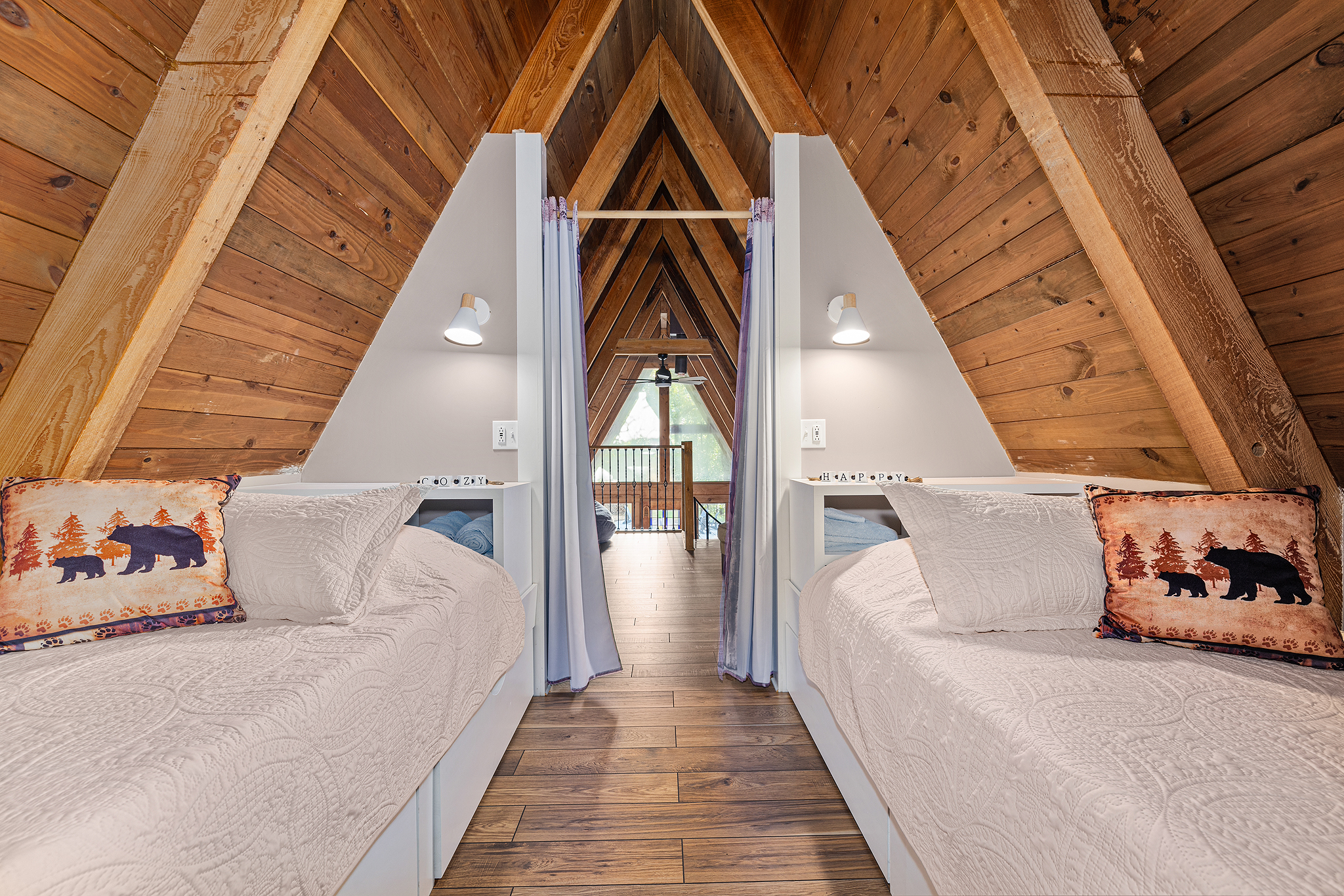The loft’s front portion offers a pair of twin beds with storage drawers.