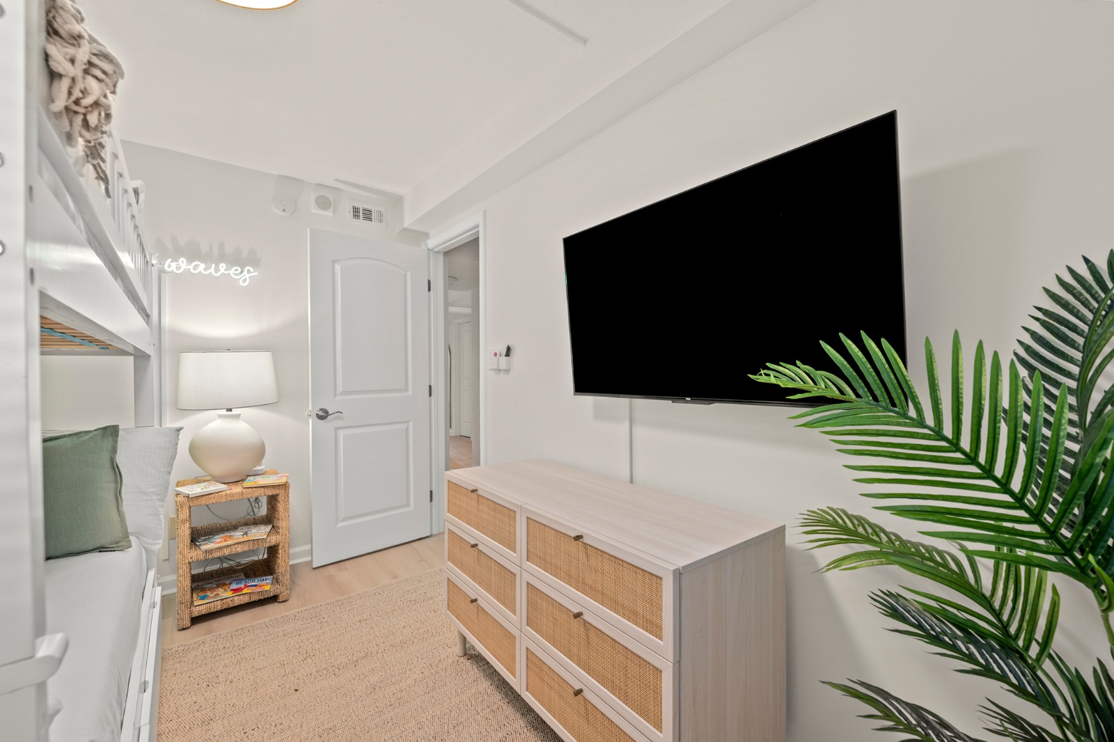 Unwind after a sun-soaked day with a family movie night in the bunk room, where the TV and cozy beds make downtime fun and easy.