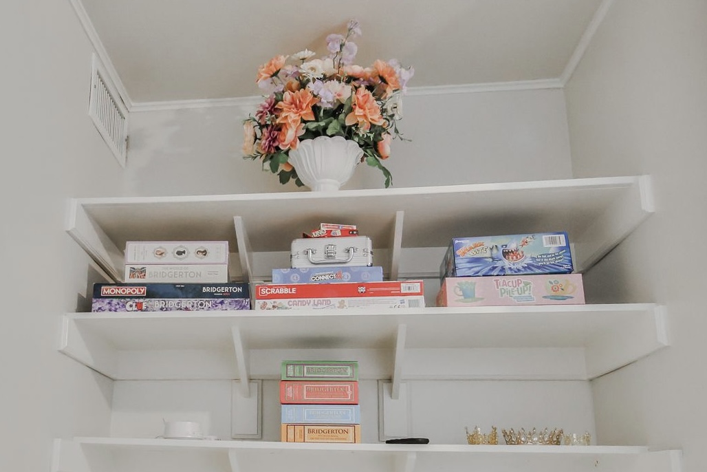 An assortment of games awaits to entertain the ton—classics like Clue and Monopoly with a Bridgerton flair, perfect for laughter, rivalry, and a little lighthearted scheming after tea.