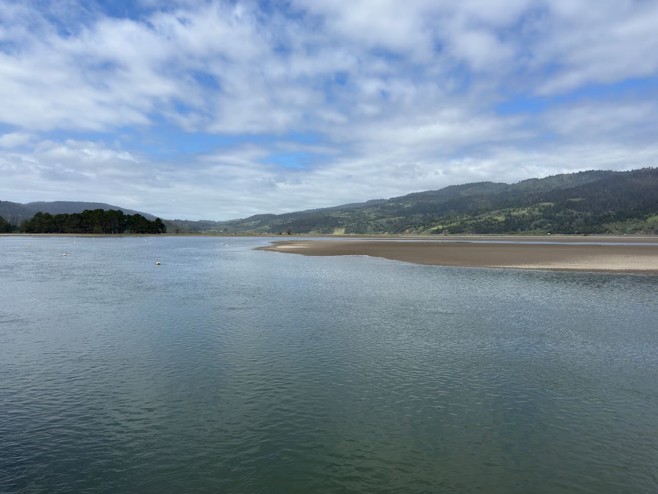 Stylish water views with rolling hills in the distance.

