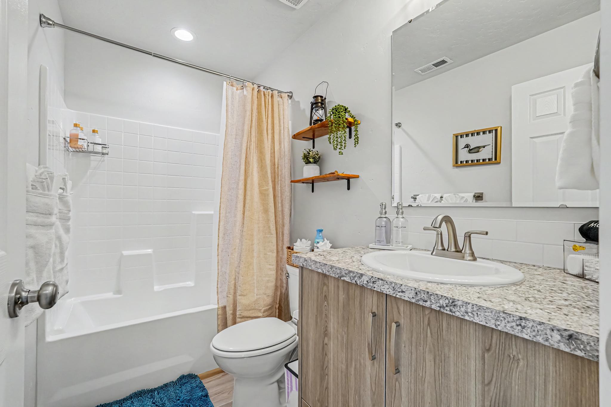 The upstairs bathroom has a nice tub for soaking in after a long day of exploring or working. 