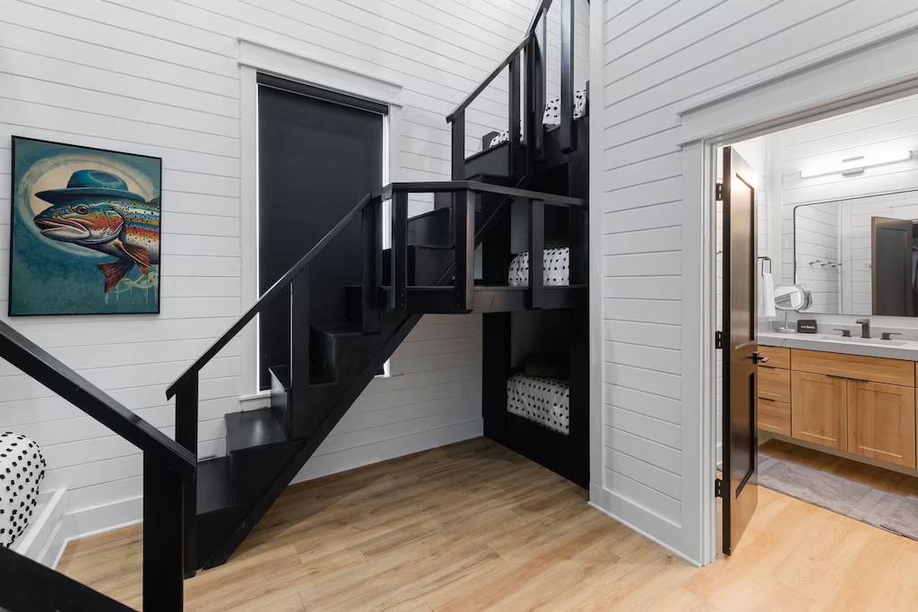Lofted Bunk Room: Fun spiral stairs lead to playful sleeping nooks, perfect for young adventurers!