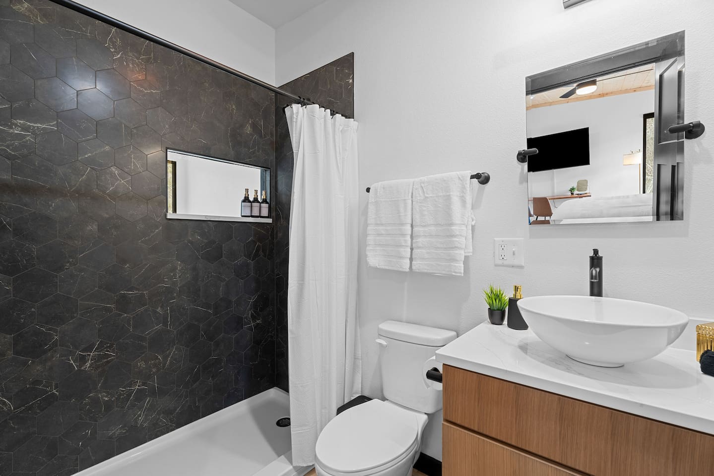 Modern Bathroom: Enjoy a sleek shower and stylish details - Even this interior bathroom has a view to the outdoors!