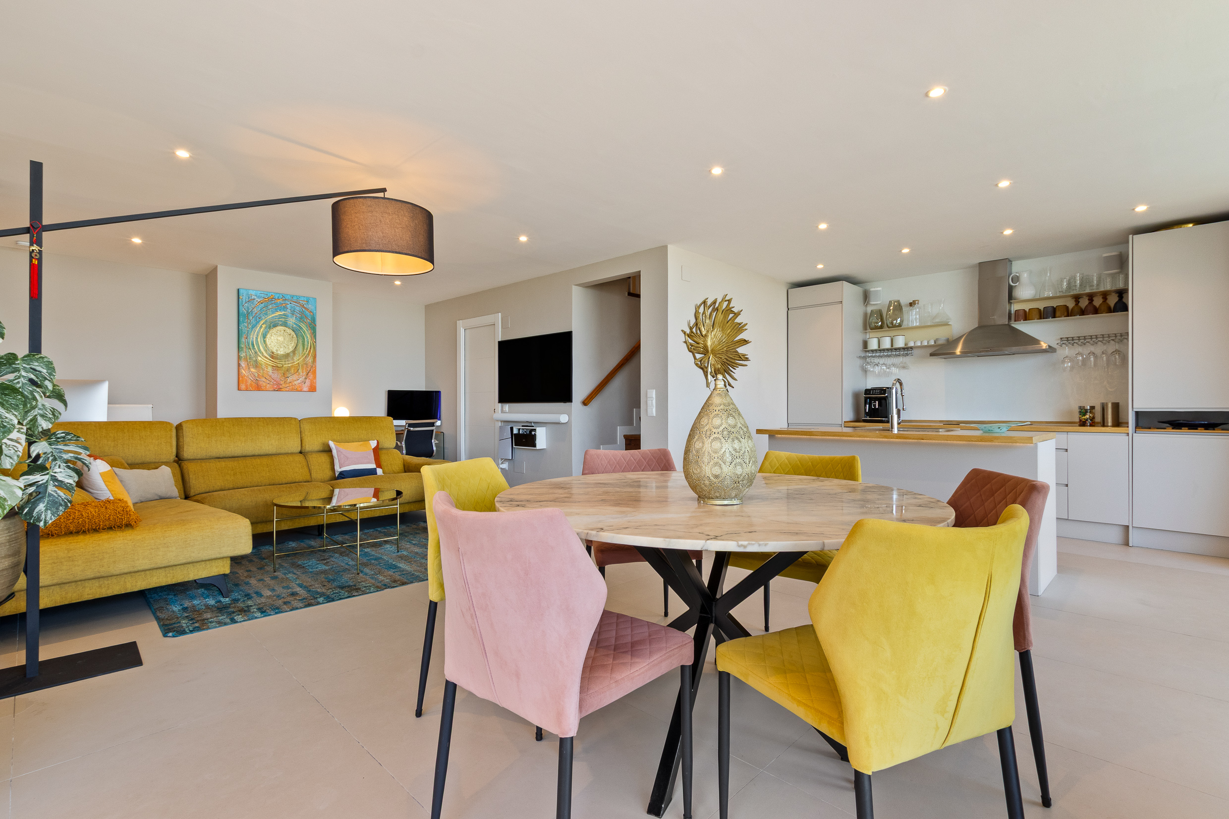Open-plan interior combining kitchen, dining and lounge