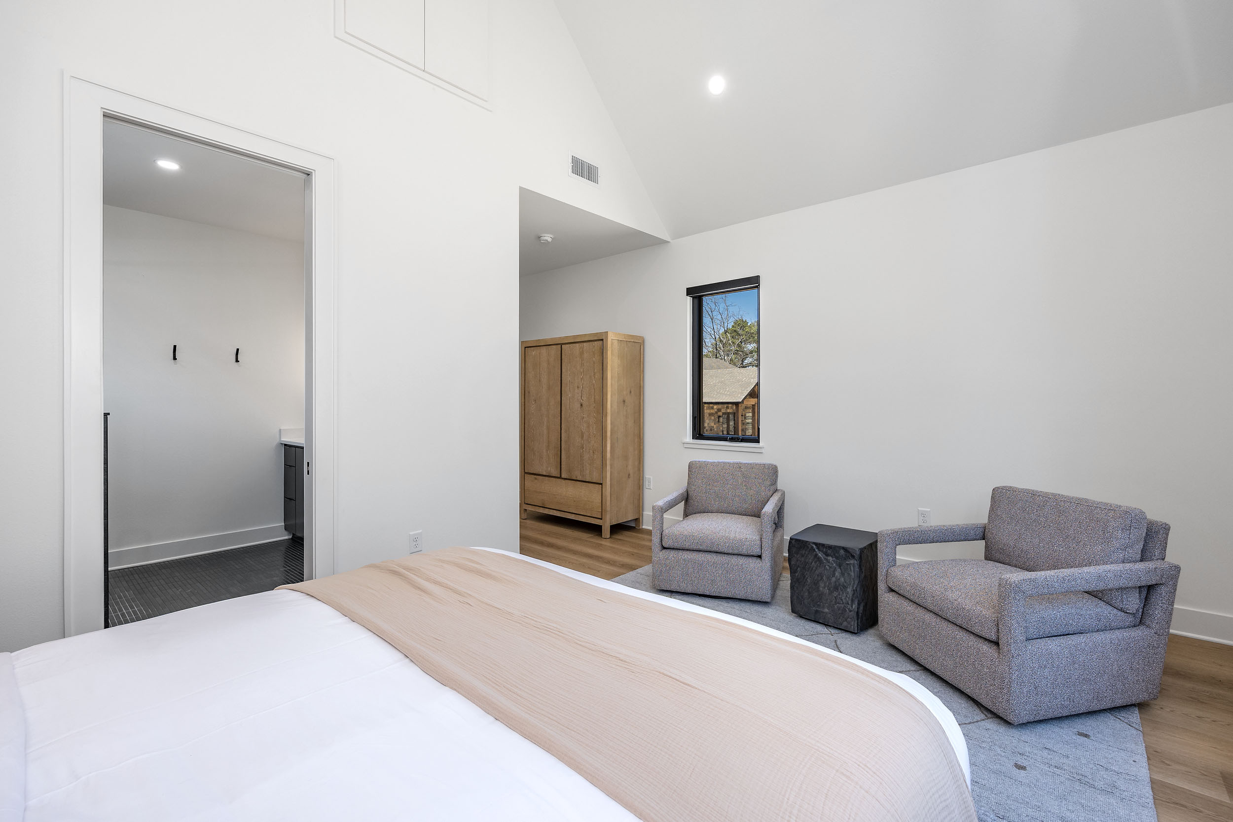  Enjoy an alternate perspective of this suite, highlighting its plush textures and tranquil seating area.