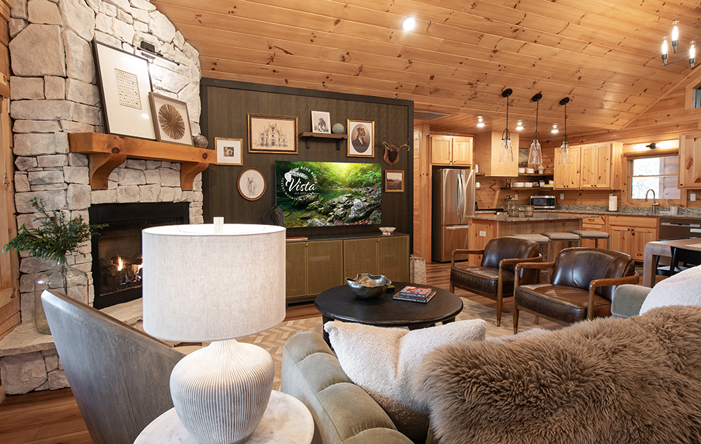 Warm wood, plush seating, and an open layout make this gathering space ideal for both lively evenings and quiet afternoons.