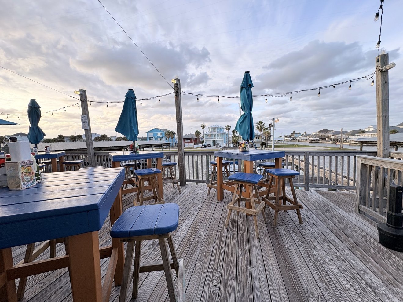 Best seating at the West End Marina Restaurant to watch the boat activity and enjoy a relaxed vibe with live music on weekends.