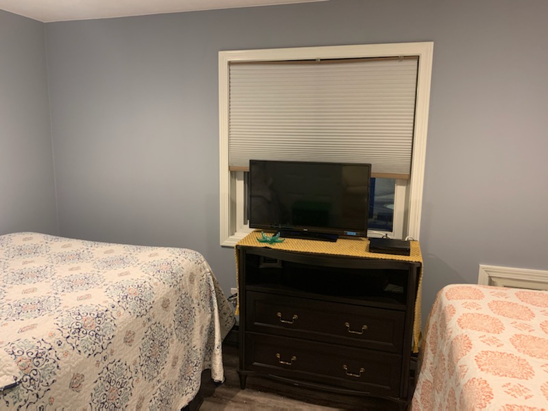 Bedroom area has its own television.