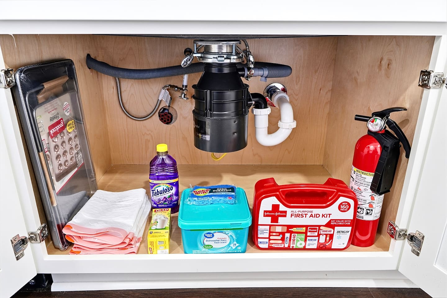 Bright white kitchen with a sleek, extended layout and ample counter space. The long layout offers plenty of countertop space, perfect for cooking, prepping, and everyday meals. Fully stocked with everything you need for a comfortable stay!