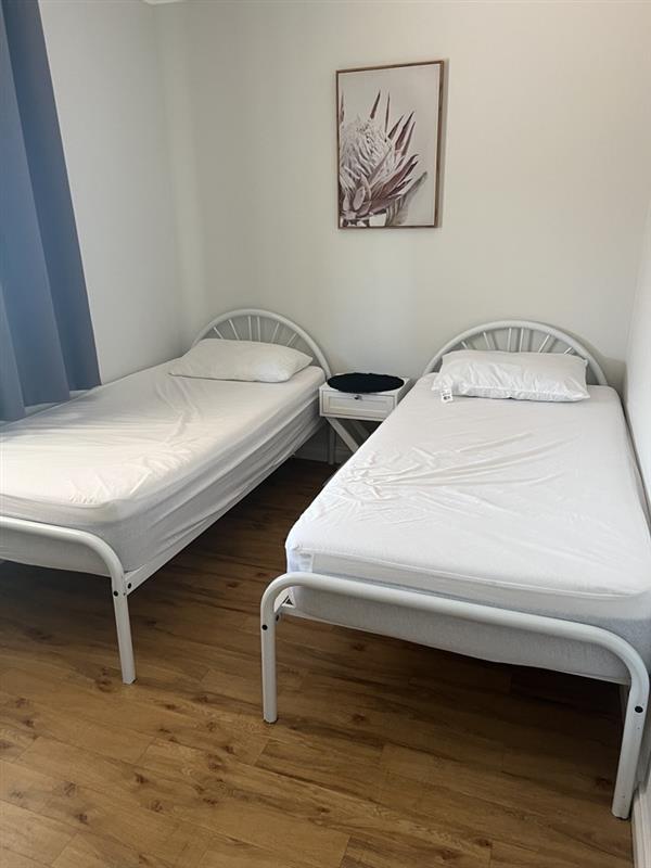 Bedroom Three with 2 single beds