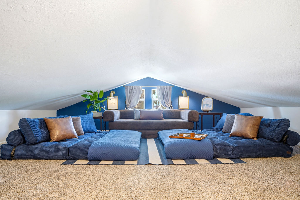 Whether you're unwinding after a day on the water or enjoying a laid-back evening indoors, this is where the fun continues off the dock in this gorgeous loft with ample seating or an additional place for guests to sleep comfortably.