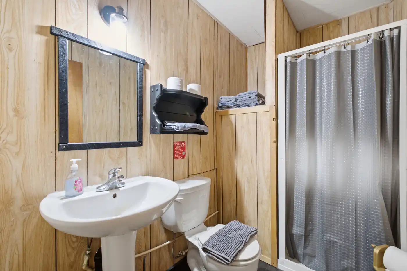 Bathroom with shower, vanity and practical storage