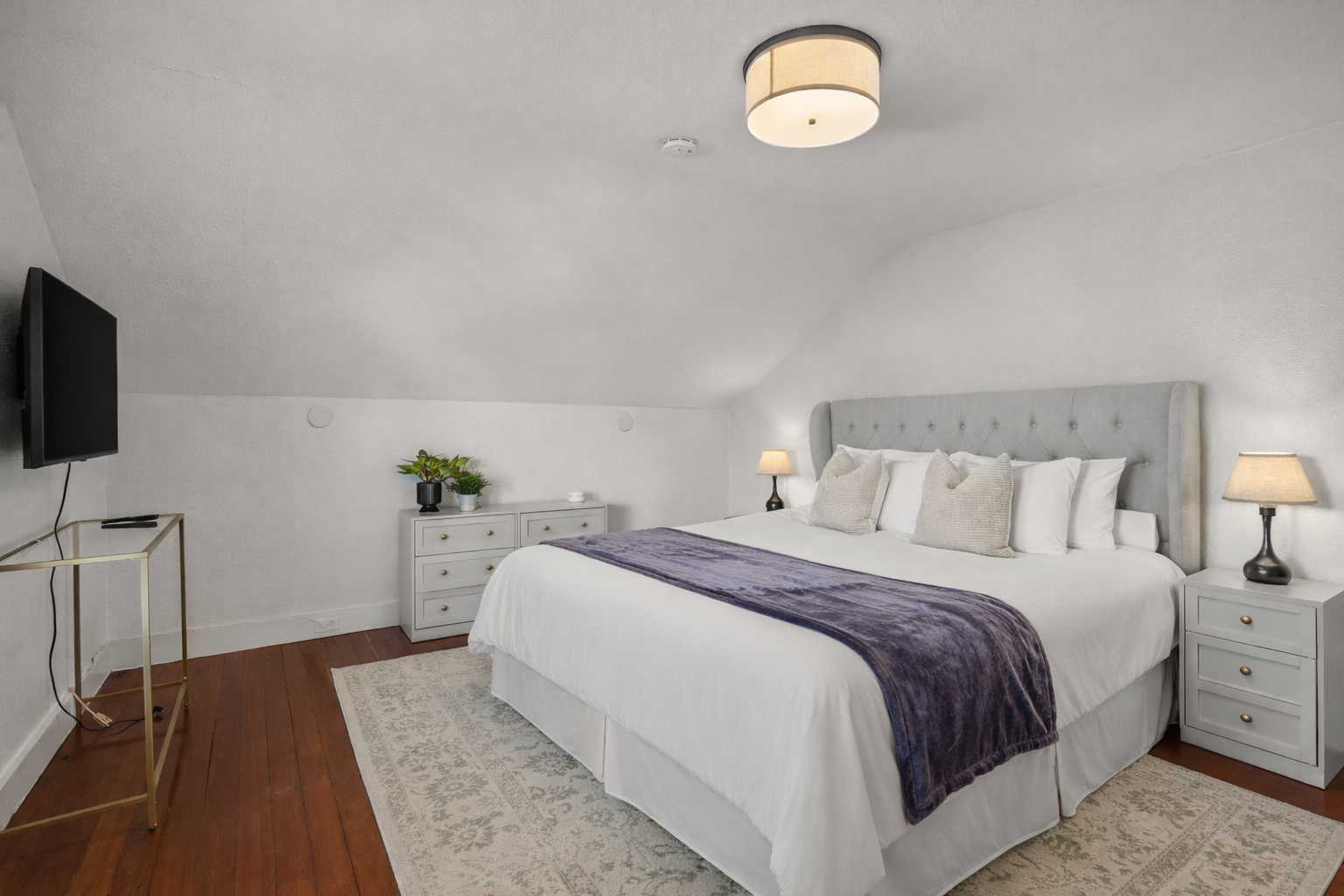 Unwind in the spacious primary bedroom featuring a comfortable king bed, Smart TV, and a large closet for all your belongings. Designed with comfort in mind, it's the perfect private retreat after a day of exploring Napa Valley.
