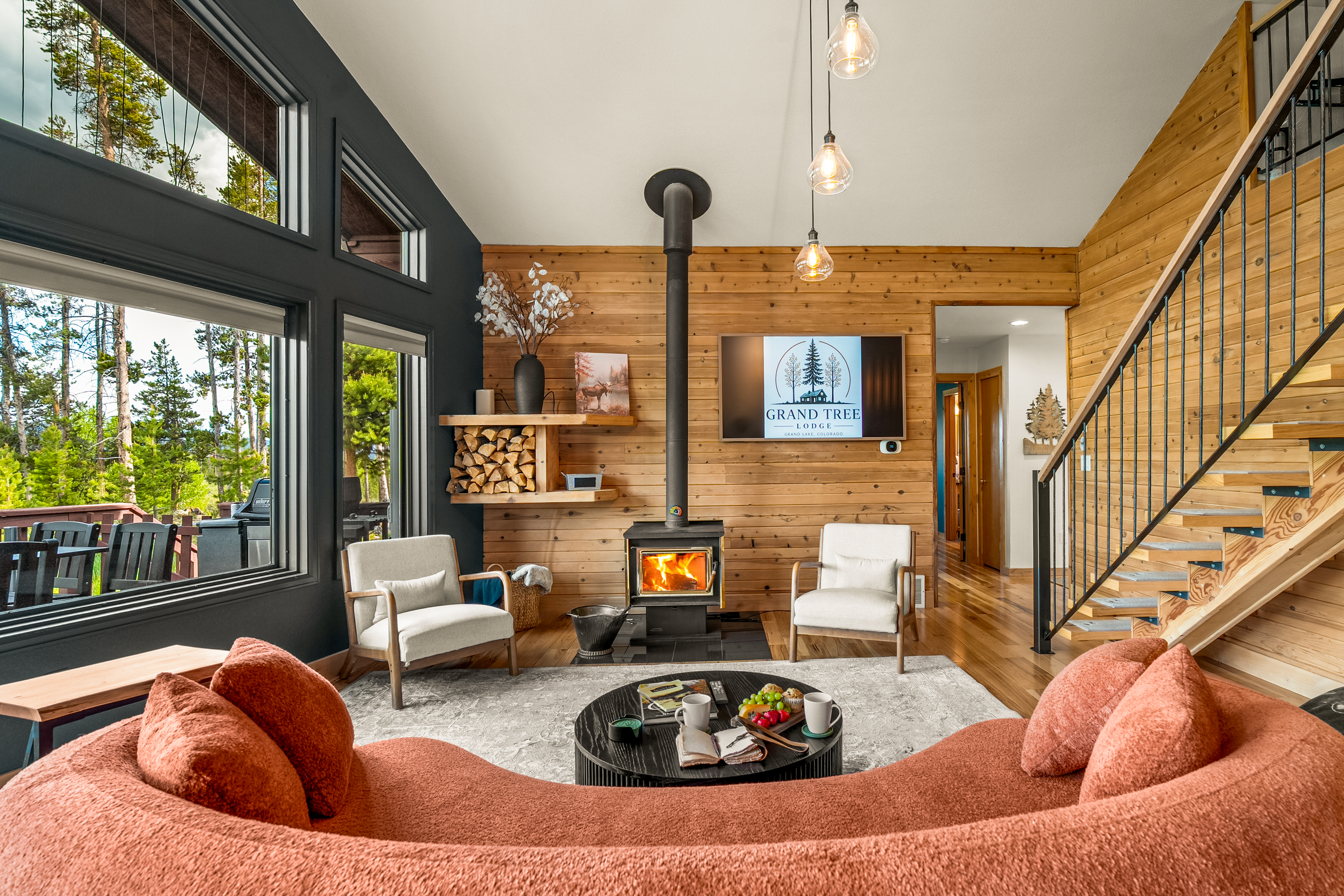 Comfortable living room complete with a large TV, fireplace, and plenty of seating