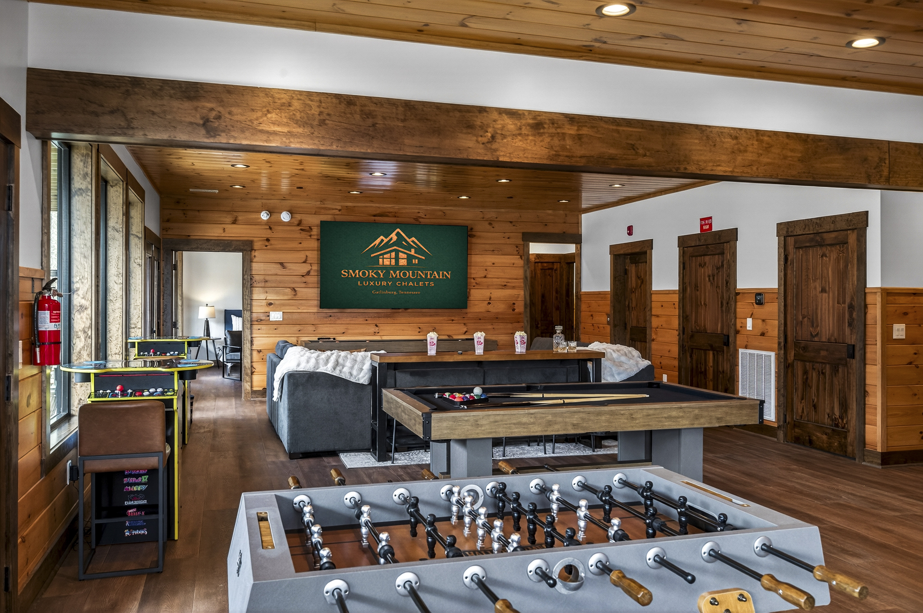 Ultimate Game Room -Watch movies or the big game on the 100-inch TV, relax on the plush sectional, or enjoy bar-top seating. Play pool, shuffleboard, foosball, and arcade tables, with a kitchenette for snacks and drinks—perfect for family fun & game nights