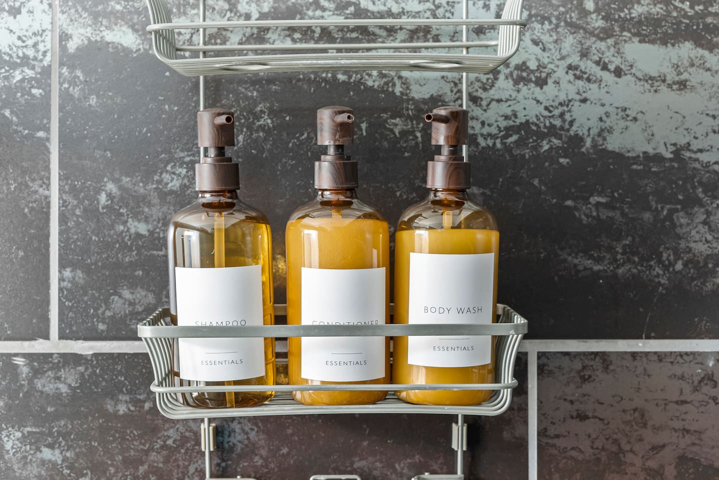 Shampoo, conditioner, and body wash provided for a hotel-like stay.