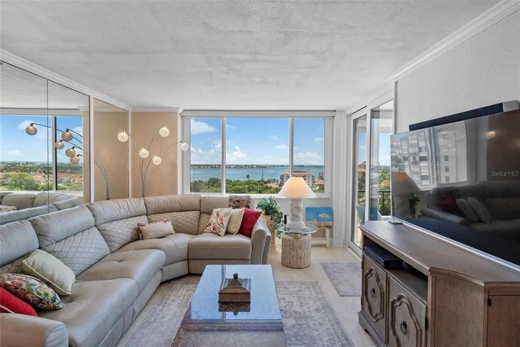 Bright and inviting, the living room is filled with natural light and offers a comfortable space to relax, stream your favorite shows, or unwind together while enjoying the coastal bay area ambiance.