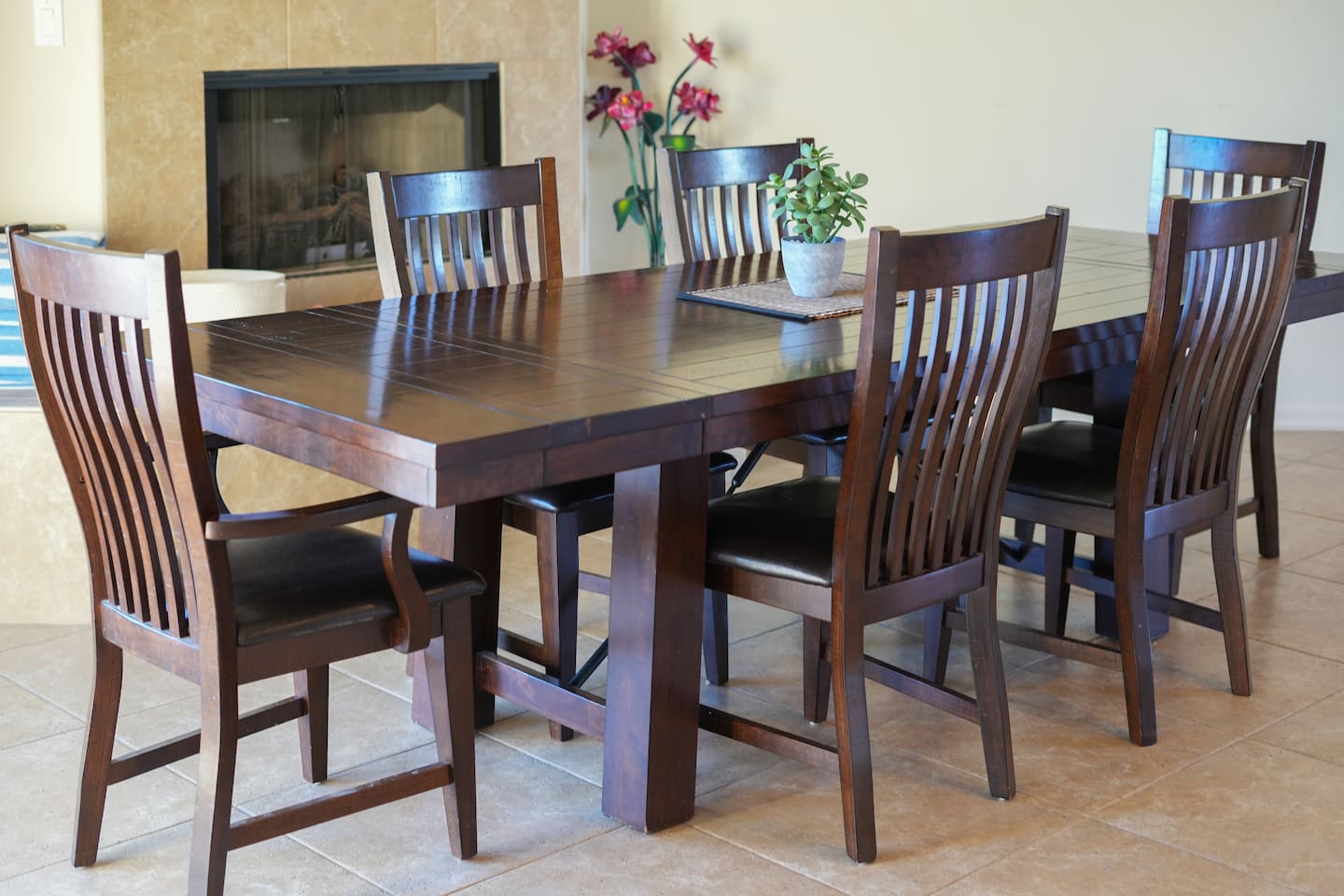 Large dining table with comfortable seating, perfect for shared meals