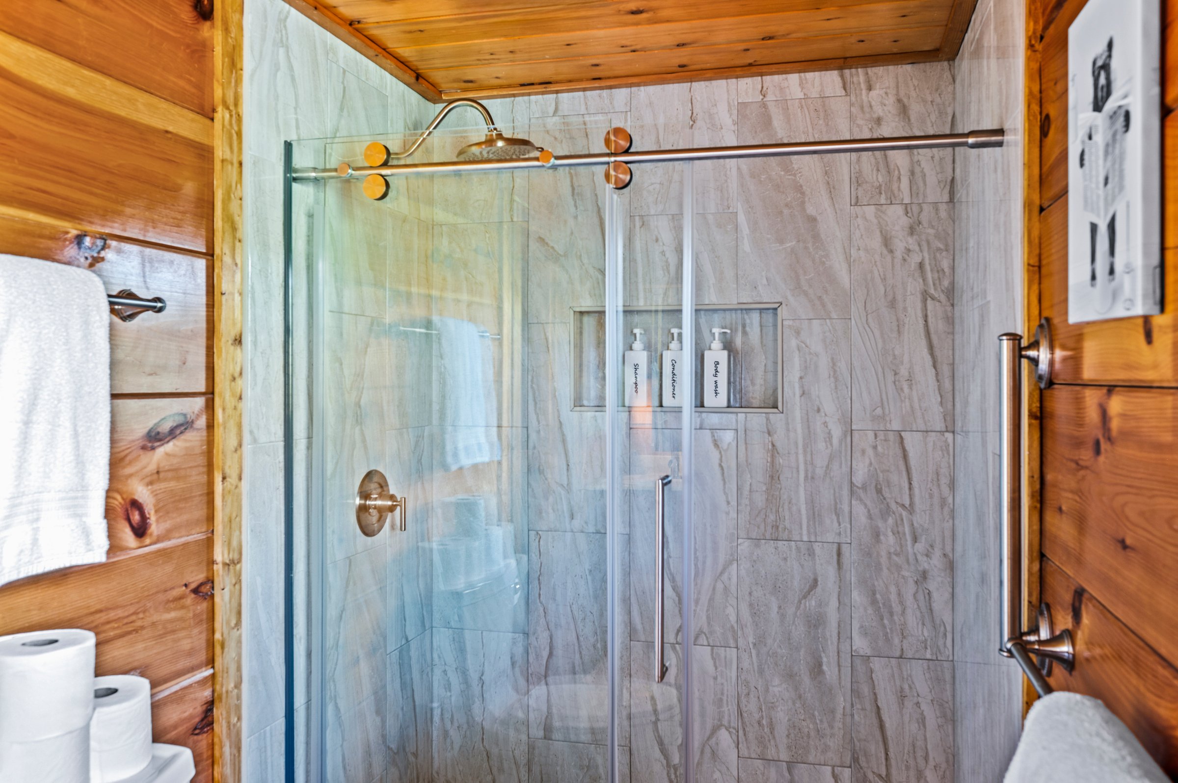 Enjoy added comfort and accessibility with a spacious walk-in shower featuring an adjustable shower head, from rain shower to standard jets.